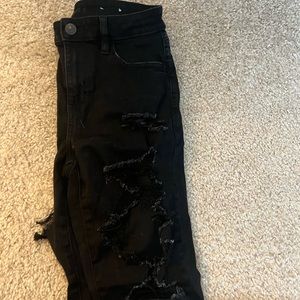 American Eagle super distressed, black skinny jeans